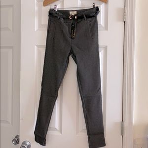 Stretchy pants with belt.